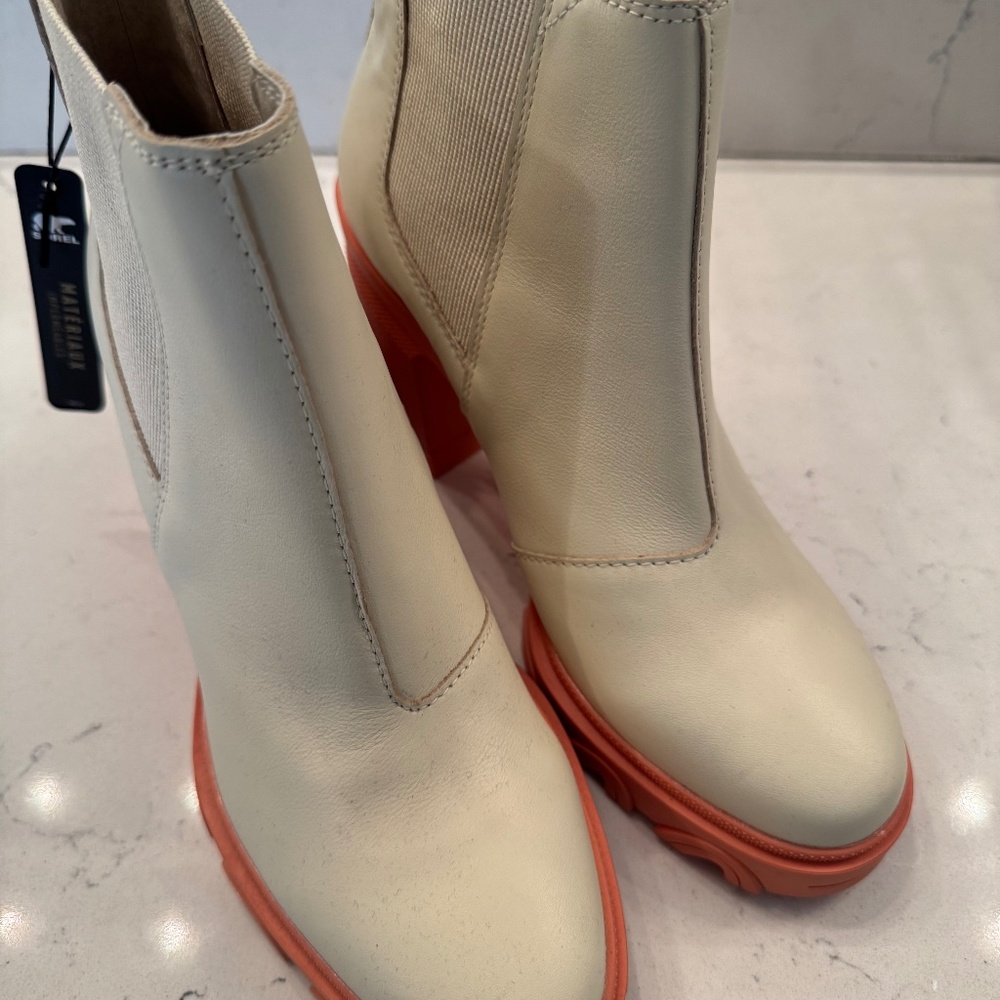 Sorel - Cream colored boot with orange platform heel